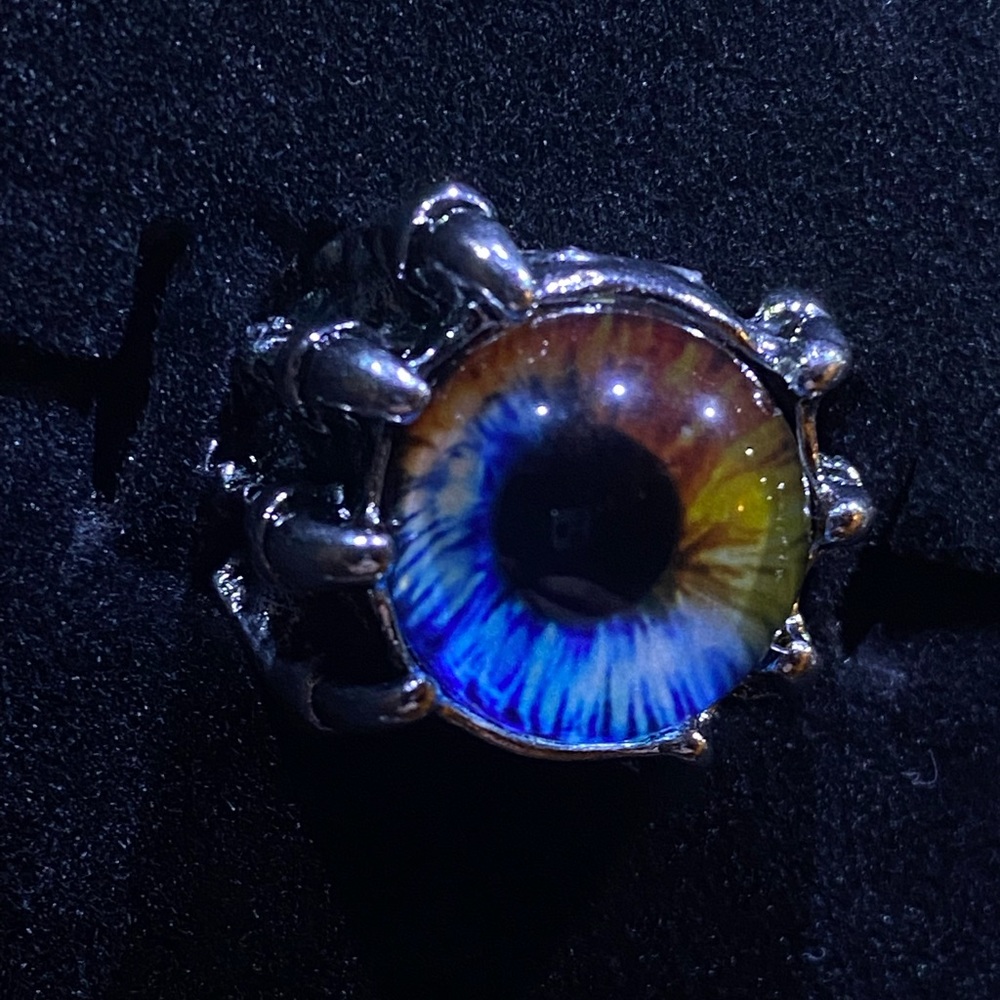 Claws Holding Blue and Yellow Eyeball Ring